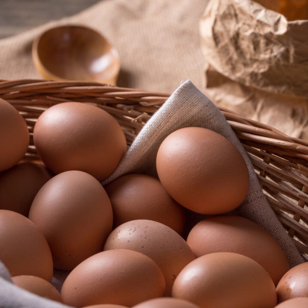 large brown eggs in a wicker basket