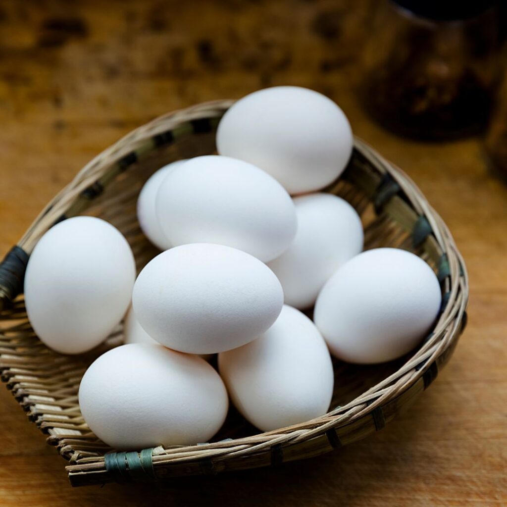 basket of large white eggs